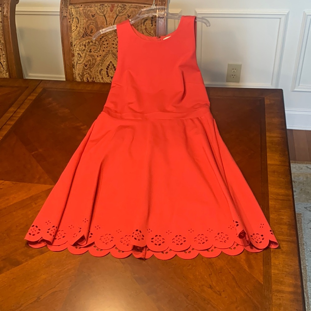 Loft- Sleeveless dress with cut out design at hem.